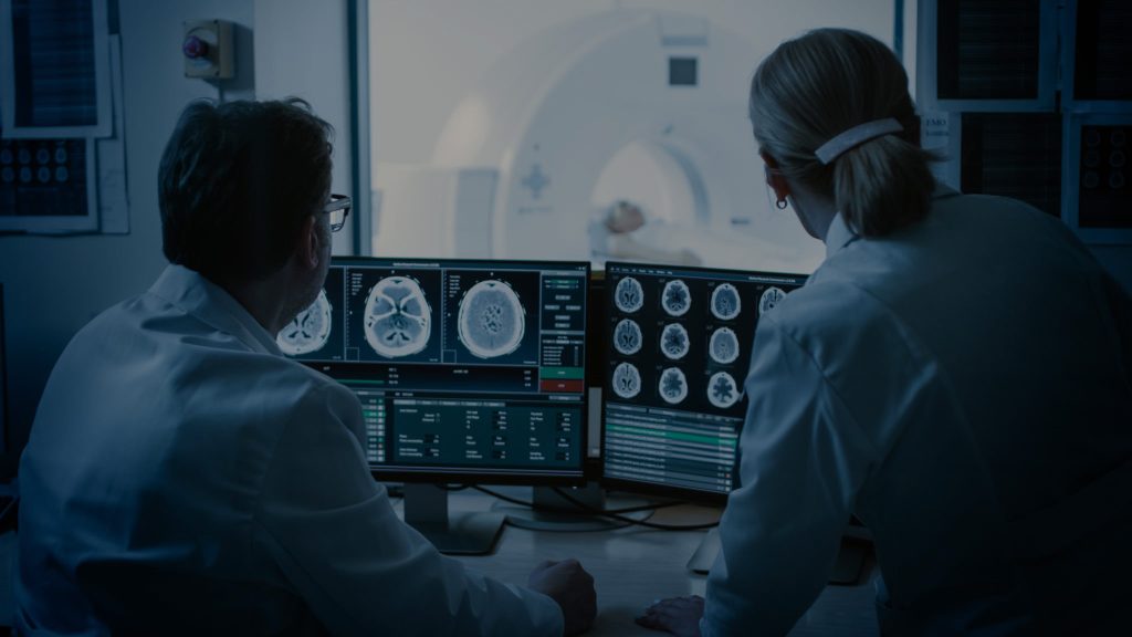 Orthopedics physicians reviewing xrays.